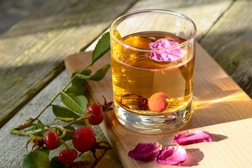 Tea from a dogrose in a glass beaker.
