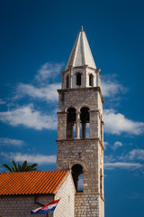 Fototapeta premium Old bell tower against blue skies