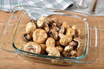 Raw mushrooms in a baking pan