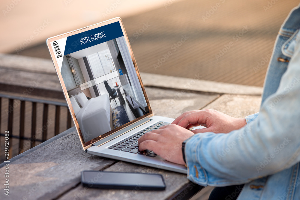 Aufkleber a man is working using laptop, searching for lodging using on-line web service, booking a hotel on w