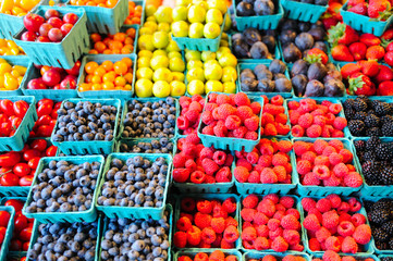 Fototapeta na wymiar Berries in aqua containers, Farmers Market