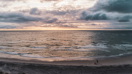 Naklejka na ściany i meble Beach Sunrise Landscape with Ocean Waves