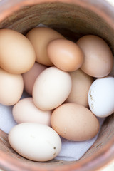Fresh eggs in an old vase of clay