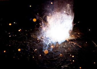 Flash and sparks from electric welding