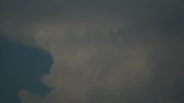 (Live action)　An aircraft passes in front of gigantic cumulonimbus around 6:50PM on August 26, 2018 in Tokyo, Japan
