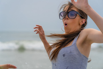 Young Tan Dark Haired Italian American Model With Shocking Expression From Cold Ocean Water Wave