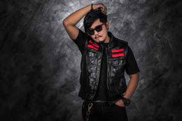 Naklejka premium biker man in black leather jacket