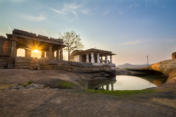 Sunset at Hemakuta Hill, Hampi. Hampi, capital of the Vijayanagara empire, sits on the banks of the Tungabhadra River.