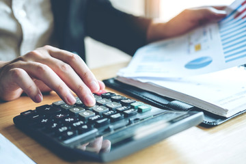 Fototapeta premium Business man Accounting Calculating Cost Economic