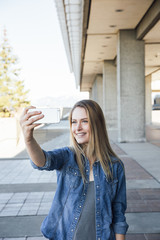 Woman in her twenties taking a selfie or videocalling