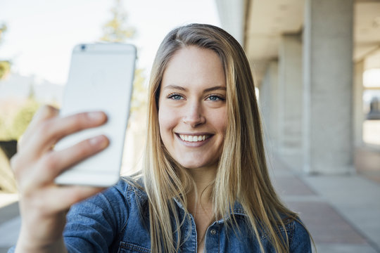 Woman in her twenties taking a selfie or videocalling