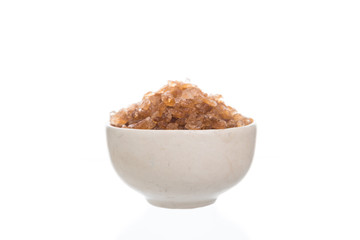 Brown rock sugar isolated on white