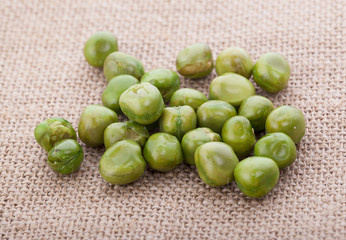Pile of green wet pea isolated on white background