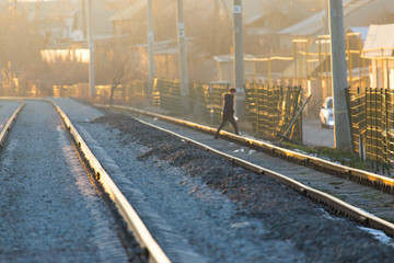 Fototapeta na wymiar a man crossing a railway