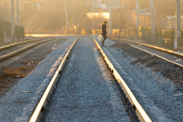 Fototapeta na wymiar a man crossing a railway