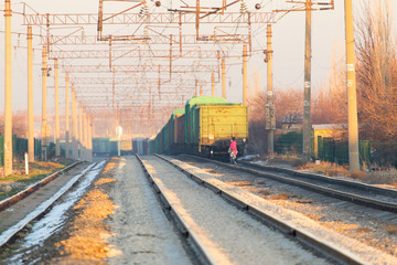 Obraz na płótnie Canvas a man crossing a railway