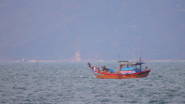 South China Sea, Central Vietnam, Asia, August 27 2018. Vietnamese fishing boats navigating across the South China Sea, deep sea fishing in wooden boats.