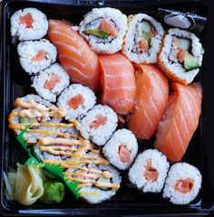 close up on fresh sushi on black tray