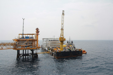 Supply boat transfer cargo to oil and gas industry and moving cargo from the boat to the platform