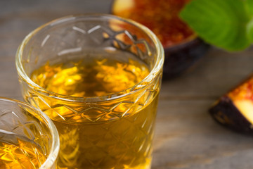 fresh figs fruits, liqueur and mint, closeup shot