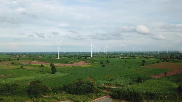 Aerial view of Windmills for electric power production at Huai Bong, Dan Khun Thot district, Nakhon Ratchasima. Large wind turbines were surrounded by corn field, Potato field and sugarcane field