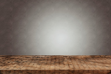 Empty wooden table over purple wall