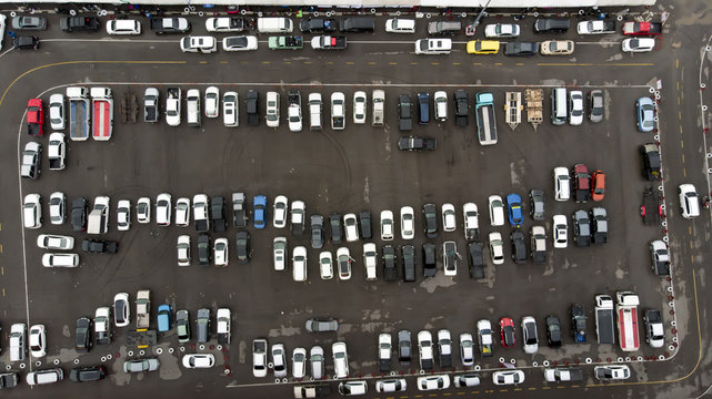 Aerial Top view of  cars lined up at football stadium