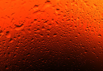 a drop of water on the glass against the light