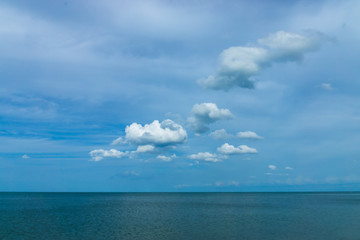 Minimal sea with tiny clouds