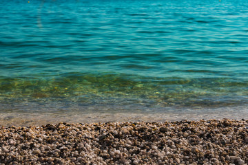 Blue sea by a pebble beach in Maronia, Rodopi, Greece