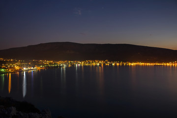 Nice lights on city Baska,with sea and mountains, long exposure, Croatia