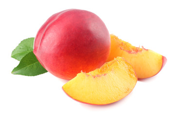 Nectarine with green leaf and slices isolated on white background.