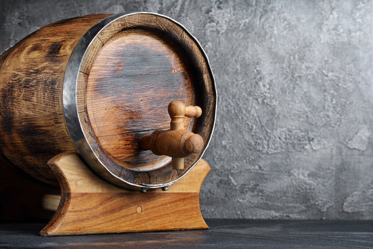 Vintage Wooden Barrel With Tap In Dark Cellar