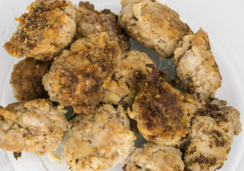 Fried homemade chops on a white background.