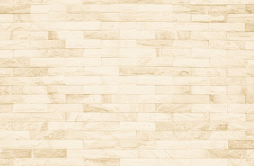 Cream and white brick wall texture background. Brickwork or stonework flooring interior rock old pattern clean concrete grid uneven bricks design stack.