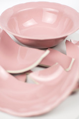 Broken and whole plate on a light background.