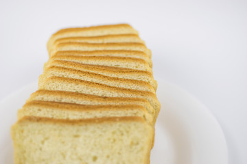 Toast bread on a white plate.