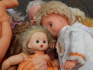 Large selection of vintage dolls and children's toys on the flea market