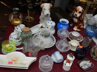 Collections of vintage items on the flea market: tableware, porcelain figurines, candlesticks