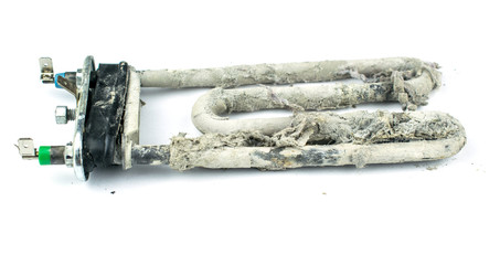 Old burnt-out heating element of the washing machine.