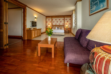 interia perspective of executive suite hotel bedroom with one bedroom and a separate living space at Rayong Chalet Rayong district Thailand
