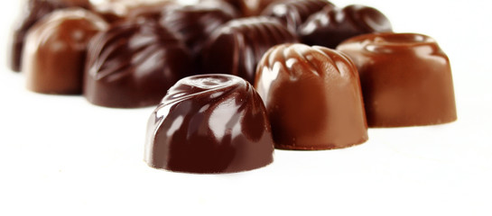 Closeup brown chocolate candy in white background