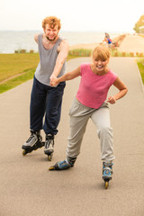 roller skater couple skating outdoor