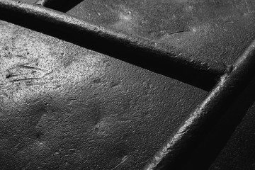 Old black steel surface. Close-up background