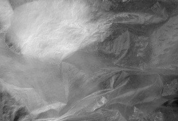 Plastic transparent old wrap texture in black and white.