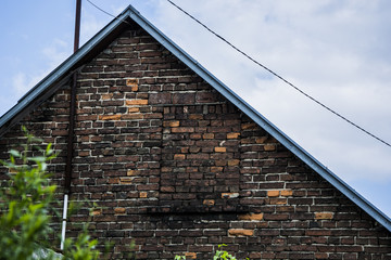Attic of an old brick house - obrazy, fototapety, plakaty