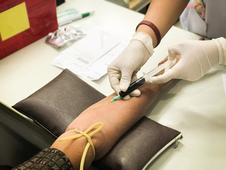Nurse taking a blood sample.