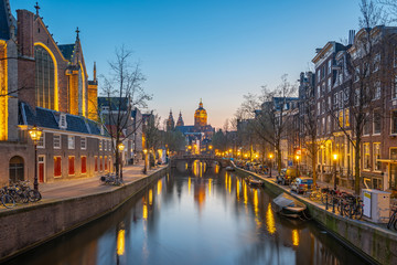 Amsterdam city at night with view of Church of Saint Nicholas in Netherlands
