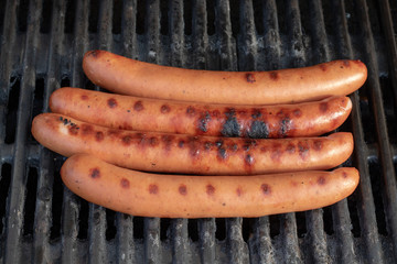 Group of barbecue sausages on the grill