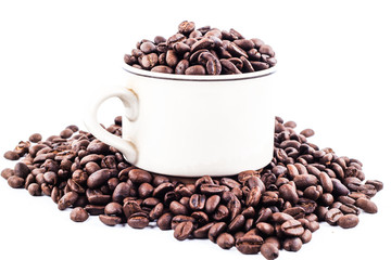 Cup of coffee full of coffee beans isolated on white background, front view